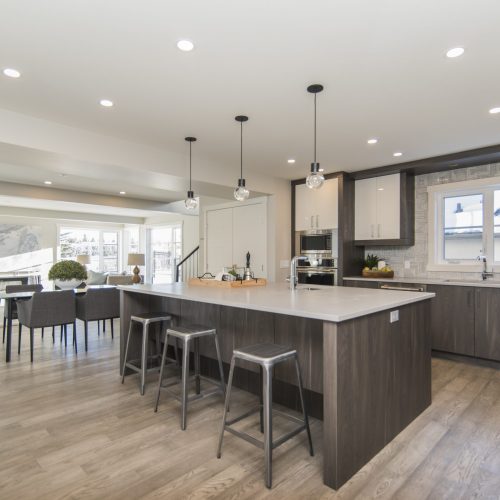 A beautiful shot of a modern house kitchen and dining room